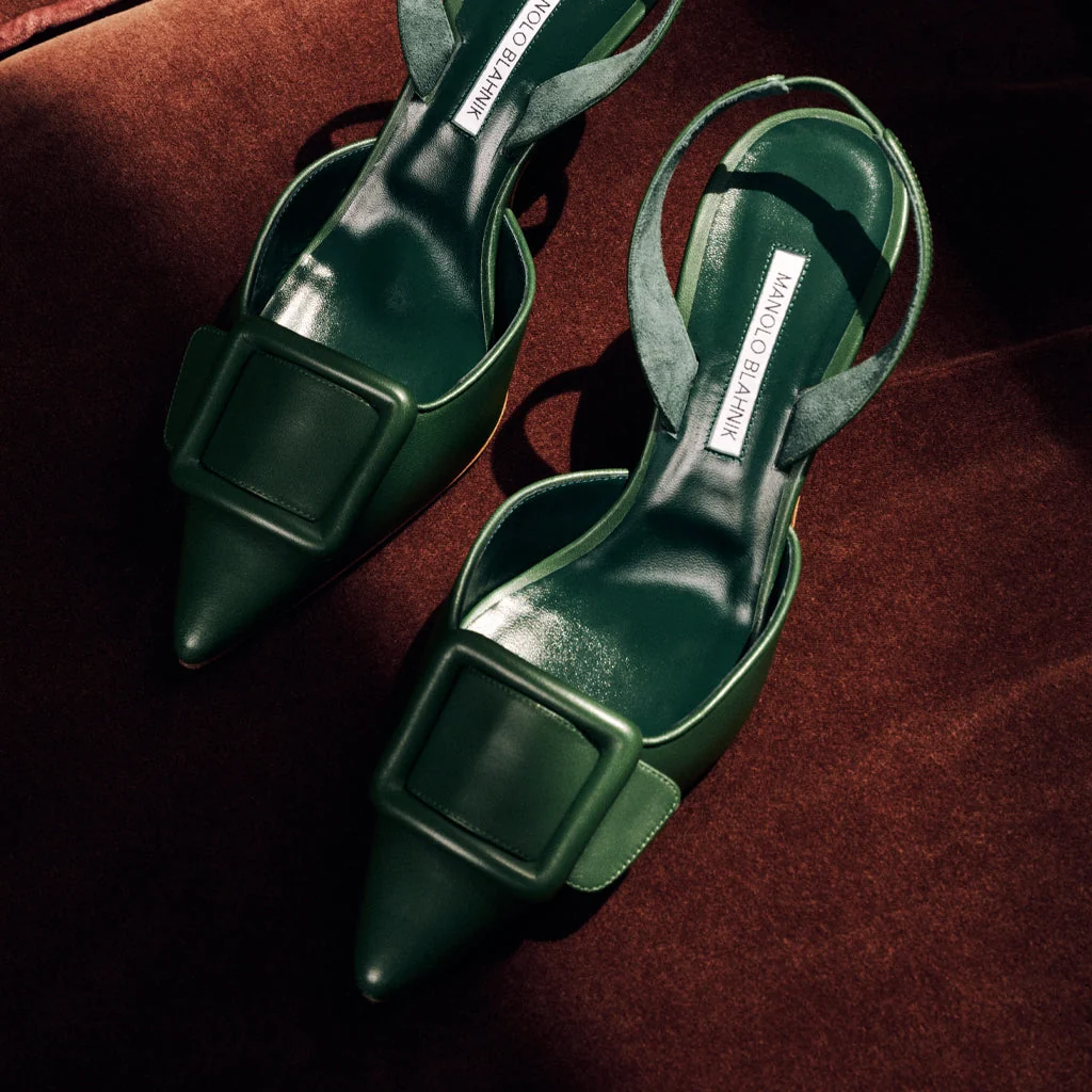 Green Manolo Blahnik heels with pointed toe design. 