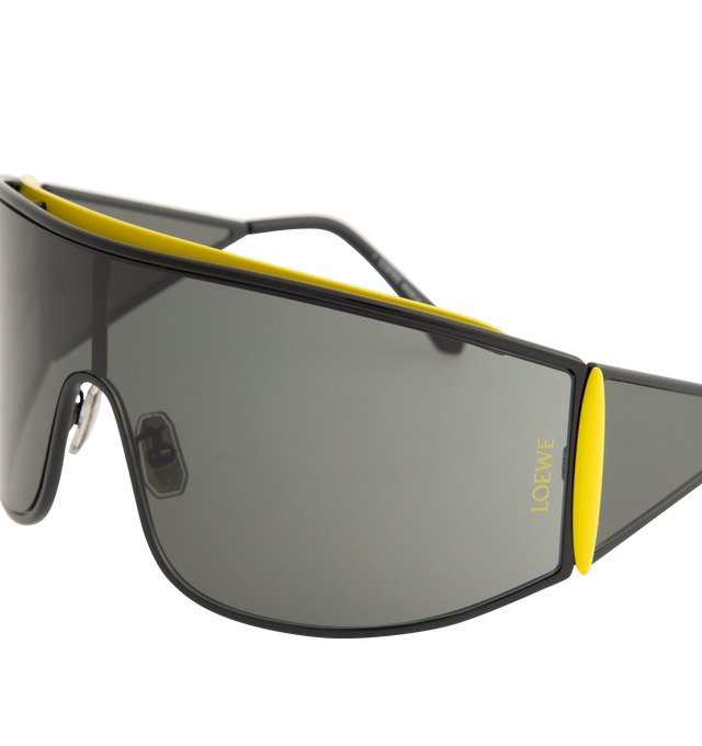 Image 3 of 3 - BLACK - LOEWE Speed Shield Sunglasses featuring shield-shape in a wraparound metal construction with a lens that extends into a distinctive triangle-shaped temple, complemented by contrast trim, universal fit, UVA/UVB protection and engraved LOEWE. Metal. Temple size: 12 cm. Made in Italy.