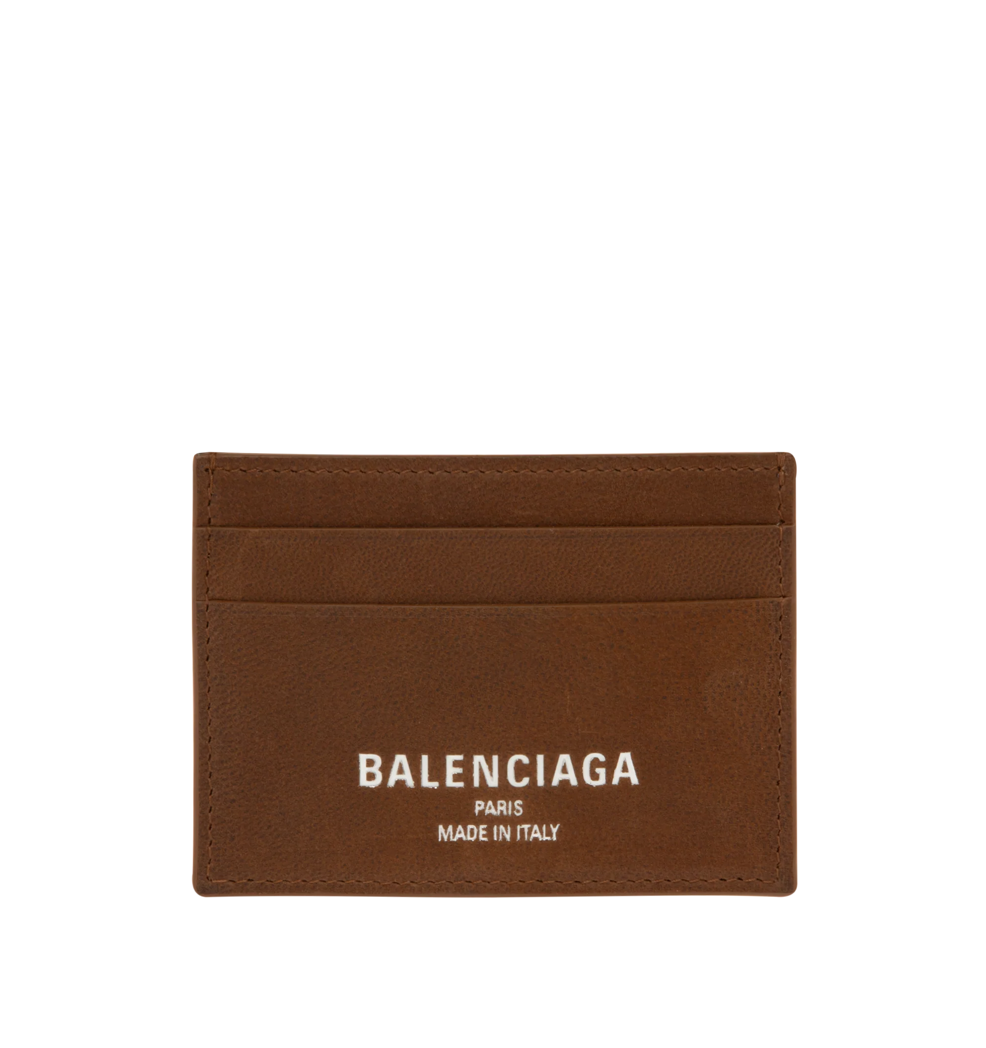 Image 1 of 3 - BROWN - Balenciaga Card Holder is crafted from smooth calfskin leather. Features four card slots, one bill pocket, and debossed Balenciaga Paris logo with silver foil at the front. Main Material: 100% Calf Leather. Made in Italy.