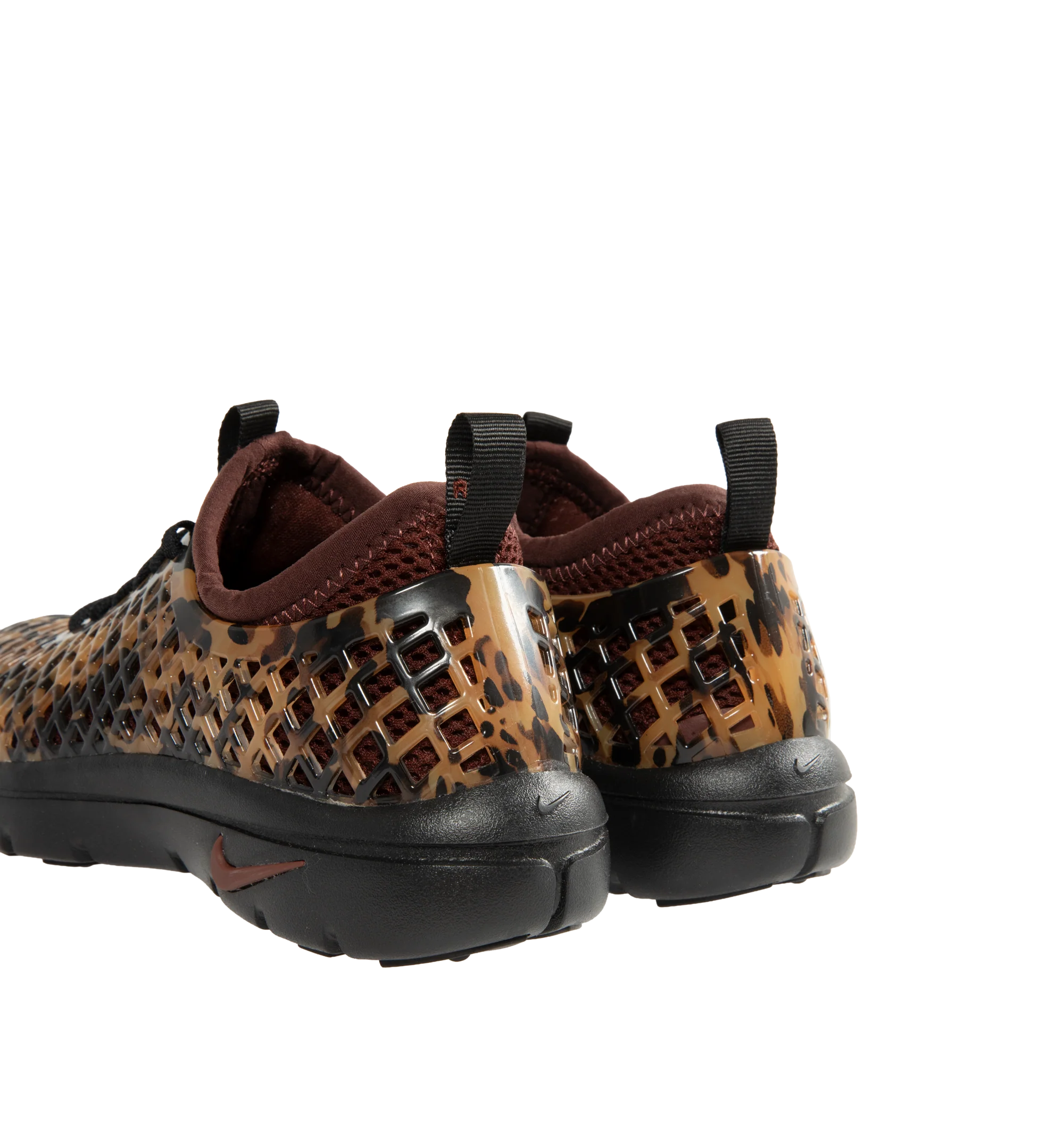 Image 3 of 6 - BROWN - Nike Women's Rejuven8 Run Sneakers feature a black and brown tortoise shell-patterned synthetic upper with a removable mesh bootie and lightly padded collar. Flat laces, heel and tongue pull tabs, a mini Swoosh at the back heel, and Swoosh branding on the sole unit complete the design. ReactX foam provides responsive cushioning, while a rubber outsole offers durable traction. Upper: Synthetic. Bootie: Mesh. Midsole: ReactX Foam. Sole: Rubber. 