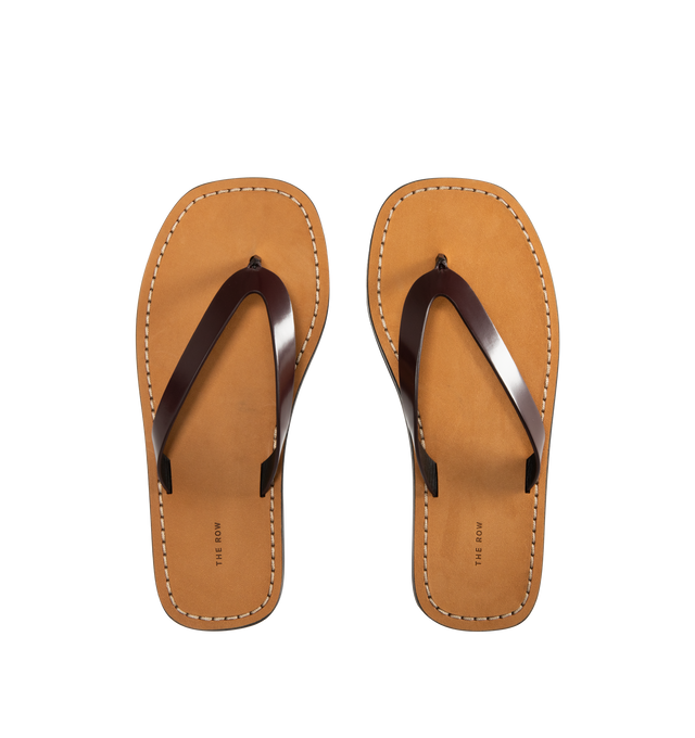 Image 4 of 4 - BROWN - THE ROW City Flip Flop featuring glossy calfskin leather with contrast leather footbed, stitched detailing, and lightly treaded rubber sole. 100% calfskin leather. Made in Italy.