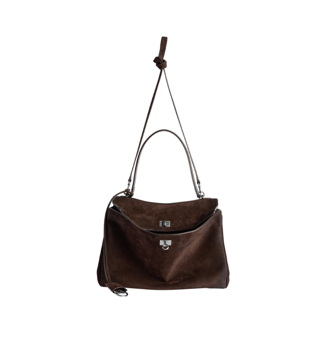 Image 3 of 4 - BROWN - BALENCIAGA Rodeo Handbag Medium in waxed suede calfskin and smooth calfskin featuring one handle, removable shoulder strap, removable cloche cls with two split rings, aged-silver hardware, turn lock closure, wide front pocket, 1 main compartment, 1 inner zipped pocket, 2 flat pockets at back, side snaps, 4 brass feet and nappa lambskin lining. L13.8 x H9.2 x W4.3 inch. Calfskin. Made in Italy. 