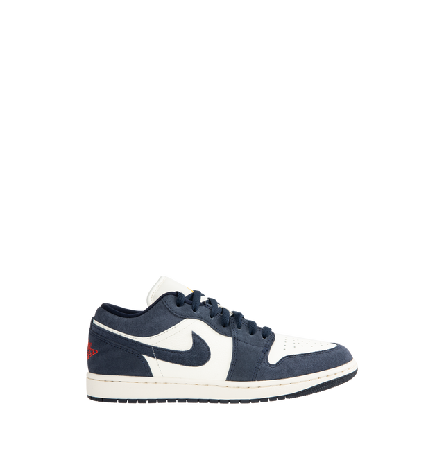 Image 1 of 5 - NAVY - JORDAN Air Jordan 1 Low SE Sneaker featuring leather in the upper, encapsulated Nike Air-Sole unit, rubber in the outsole, Wings logo on heel and Jumpman on the tongue.