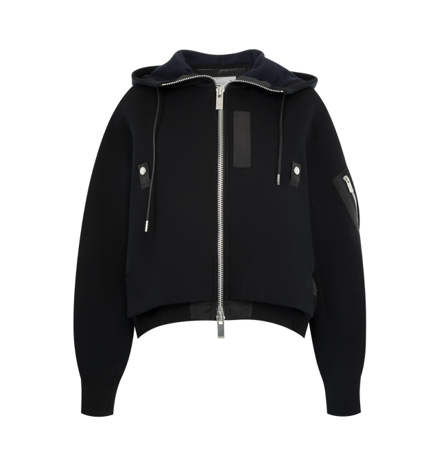 Image 1 of 3 - BLACK - SACAI Sponge Sweat x Nylon Twill Hoodie featuring padded cotton-blend jersey hoodie, drawstring at hood, two-way zip closure, logo-engraved press-stud tab at chest, concealed welt pockets, rib-knit hem and cuffs, cropped hem, utility pocket and pen slots at sleeve, dropped shoulders and nylon satin underlay. 62% cotton, 38% polyester. Lining: 55% polyester, 44% cotton, 1% polyurethane. Fill: 100% polyester. Made in Japan.