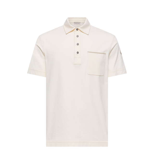 Image 1 of 2 - NEUTRAL - MONCLER Cotton Piquet Polo Shirt featuring stretch cotton blend piquet, collar, short sleeves, snap button closure, pocket with Alcantara detail and double leather logo patch. 96% cotton, 4% elastane/spandex. Made in Turkey.