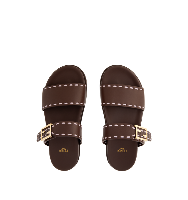 Image 4 of 4 - BROWN - FENDI Feel Slide Sandal featuring double-band flat slides with FF Baguette decorative buckle, hand-sewn contrasting macro Selleria topstitches and gold-finish metalware. 100% calfskin. Made in Italy.