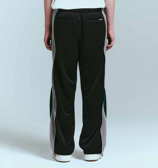Image 4 of 4 - BLACK - NAHMIAS Ollie Track Pant featuring elastic waist with drawstring closure, 4-pocket styling, embroidered logo, relaxed fit and stripes and piping down leg. 100% polyester.