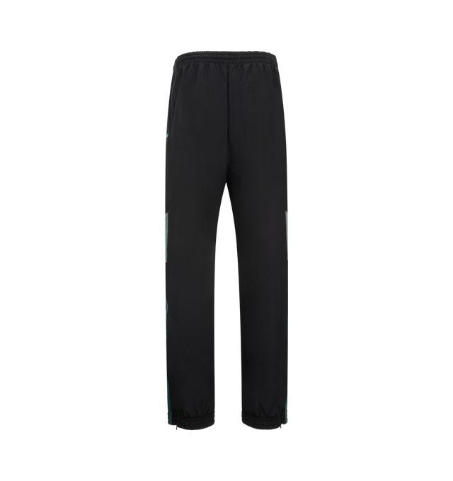 Image 2 of 3 - BLACK - MARTINE ROSE Paneled Nylon Track Pants featuring regular fit, elasticated drawstring waistband, two side zip pockets, contrasting side panels, embroidered logo and elasticated and zipped cuffs. 100% nylon. 