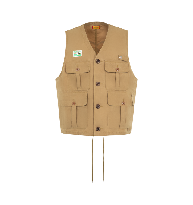 Image 1 of 2 - BROWN - HUMAN MADE Hunting Vest featuring button closure, four front flap pockets, high-density cotton-nylon with a wax coating, iconic heart motif printed on the back, duck name tag above the right chest pocket, drawstring hem, v neck and sleeveless. 75% cotton, 25% nylon.