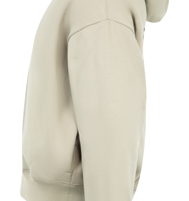Image 3 of 3 - NEUTRAL - FEAR OF GOD ESSENTIALS Property Lounge Half Zip Hoodie heavy 480GSM core fleece, Essentials Property logo is branded on the back in a satin stitch, half zip front, double-layer hoodie, side pockets, rib-knit cuffs, waist-hem and an Essentials signature label on the hood edge. 80% cotton, 20% polyester.