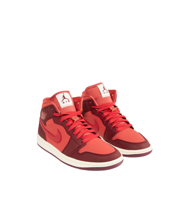 Image 2 of 5 - RED - JORDAN Air Jordan 1 Mid SE Sneaker featuring leather in the upper, encapsulated Nike Air-Sole unit provides lightweight cushioning, rubber in the outsole, lace closure, wings logo on collar and Jumpman on tongue. 