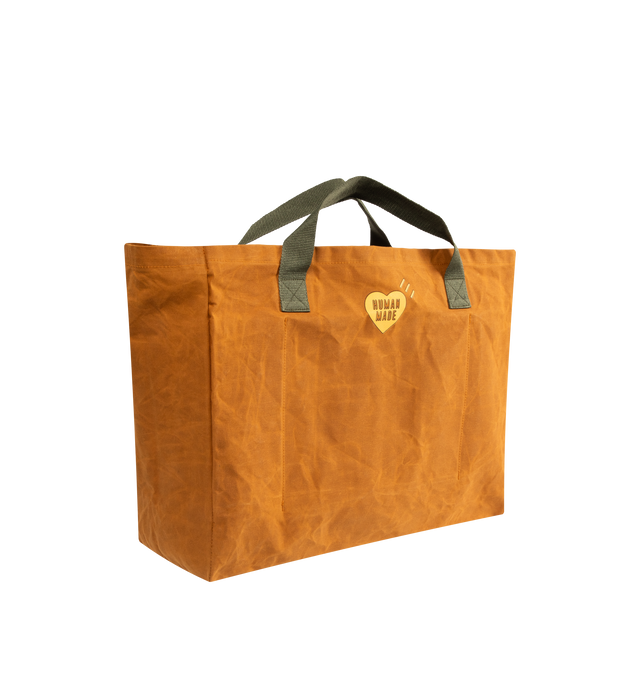 Image 2 of 3 - BROWN - HUMAN MADE Decoy Tote featuring vintage-inspired design, cotton canvas fabric, highly water-repellent with unique texture from paraffin treatment, contrasting handles, iconic camo and heart logo graphics on front and back, dye-print graphic, leather patching details and inner storage sections. 100% cotton.