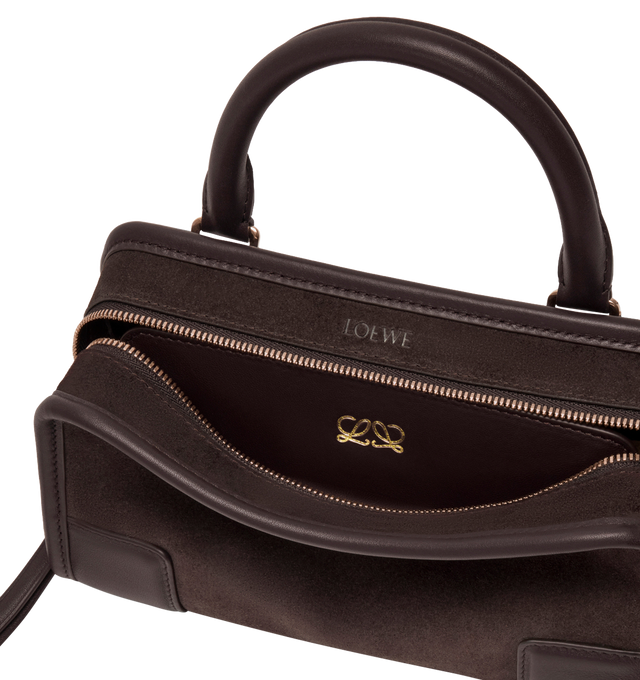 Image 10 of 13 - BROWN - LOEWE Mini Amazona 180 Bag in suede featuring a relaxed silhouette anchored by a single toron top handle, designed to be carried open, while a concealed closure secures the main compartment, removable shoulder and crossbody straps, two carry options: short handle, removable and adjustable crossbody strap, zip closure with two leather zip pullers, two compartments, main compartment closed with magnetic closure, left side d-ring for customization, suede and nappa lambskin lining, embo 