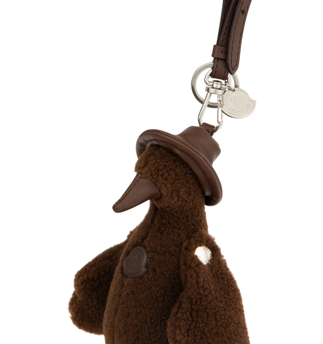 Image 4 of 4 - BROWN - MONCLER MonDuck Teddy Key Holder featuring faux leather details, carabiner with strap and metal logo. Measurements H 22 cm. 73% polyester, 27% acrylic. 100% polyester. 100% metal alloy. Made in Italy.