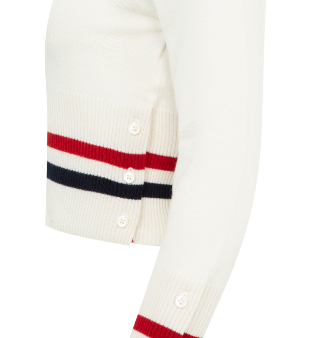 Image 3 of 3 - WHITE - THOM BROWNE Cashmere RWB Stripe Shrunken Cardigan featuring V-neckline, rront button closure, ribbed buttoned cuffs with RWB grosgrain trim, buttoned side vents with RWB grosgrain trim, ribbed hem, knit RWB tipping at cuffs and hem, signature striped grosgrain loop tab and shrunken fit. 100% cashmere. Made in the United Kingdom.