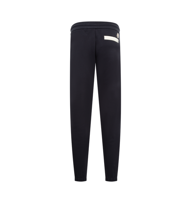 Image 2 of 4 - NAVY - MONCLER Sweatpants featuring elastic waistband with drawstring fastening, side slit pockets, back welt pocket, elastic hem, logo on back and front leg. Cotton.