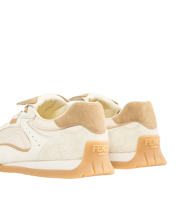 Image 3 of 5 - WHITE - FENDI Wave Pulse Sneaker featuring low-top, lace-up, suede, technical fabric and printed details, contrasting cavallino calfskin inserts and folded tongue, mlange tubular laces, three-dimensional rubber logo on the side, gold-colored metal Fendi logo on the tongue, rubber running sole with wraparound edge on the side and diagonal F motif. 100% calfskin. Inside: 100% lambskin. Made in Italy.