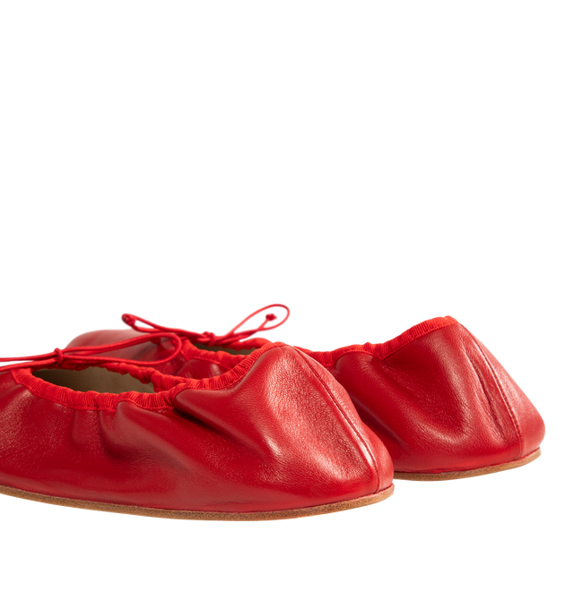 Image 3 of 4 - RED - The Row Classic ballet flat in smooth nappa leather with grosgrain piping, adjustable elastic tie, and flexible leather sole. 100% Lambskin Leather with leather sole. Made in Italy.