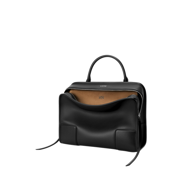 Image 4 of 16 - BLACK - Loewe Amazona 180 large bag takes on a relaxed silhouette anchored by a single toron top handle. It is designed to be carried open, while a concealed closure secures the main compartment. Removable shoulder and crossbody straps make it highly versatile. This large version is crafted in soft calfskin. Three carry options: short handle, removable shoulder strap and crossbody. Features zip closure with two leather zip pullers, two compartments, main compartment closed with magnetic clos