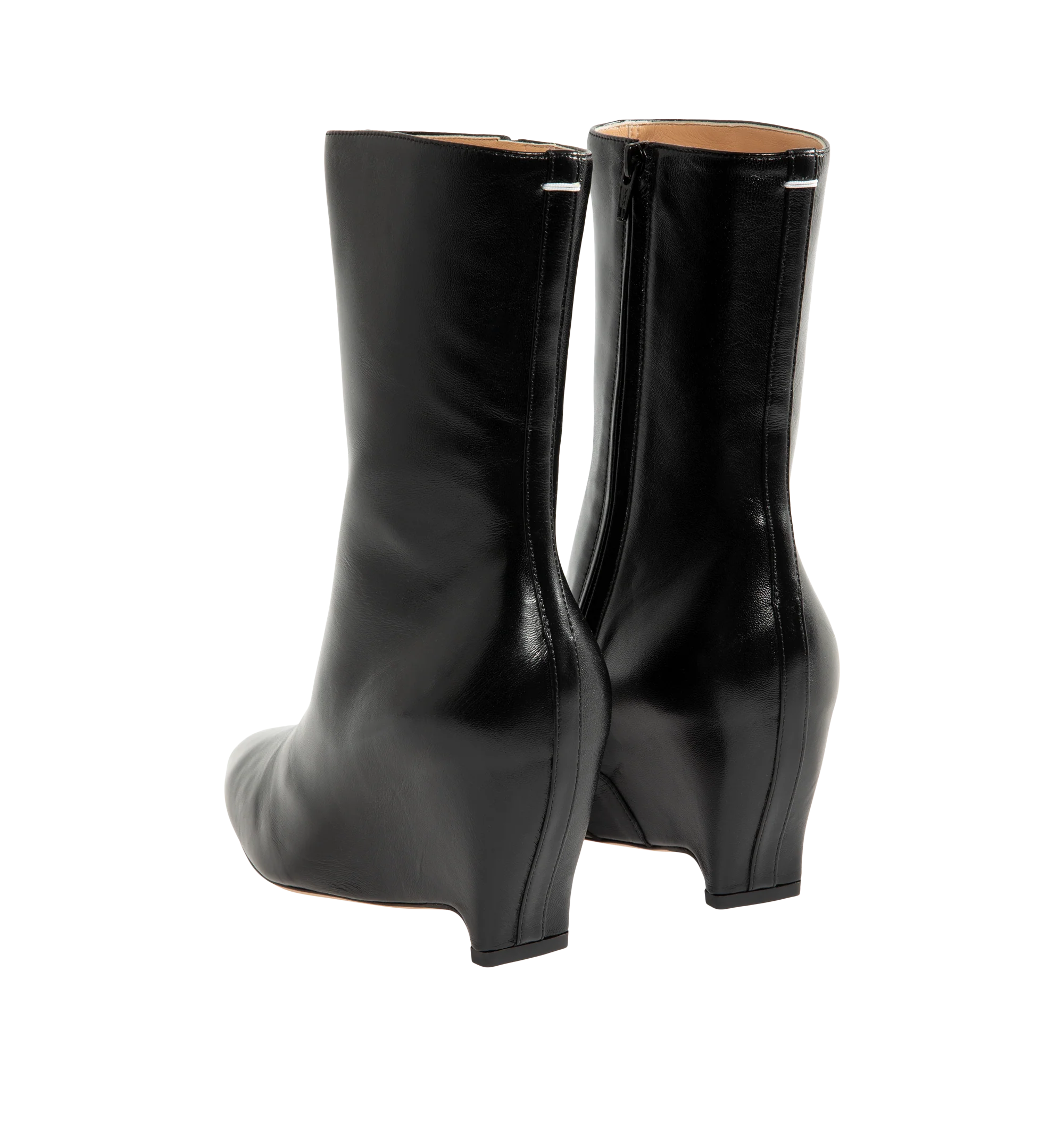 Image 3 of 4 - BLACK - Maison Margiela Women's Heel-Less Ankle Boots are crafted from soft nappa leather and reinterpret the Maison's archival heel-less silhouette with a sleek pointed toe and sculptural wedge heel. The seamless upper rises into an 80mm wedge, while the signature single white stitch at the back provides an understated house detail. Upper: 100% Ovine Leather. Lining: 100% Ovine Leather. Inside: 100% Ovine Leather. Sole: 100% Calf Leather. Heel Height: 80 mm / 3.1 in. Made in Italy.