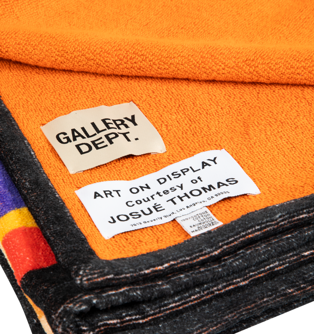 Image 2 of 2 - MULTI - GALLERY DEPT. G Print Towel featuring towel of a multicolor grid pattern of repeating 'G' logos, solid contrast tone on the reverse side and 'art on display' patch. 60" L x 28" W. 100% cotton. Made in Italy.