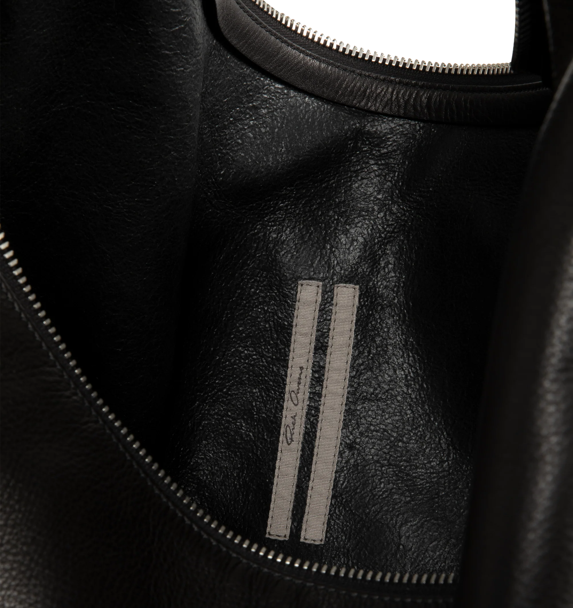 Image 3 of 3 - BLACK - Rick Owens Gemini Bag is crafted from glossy butter calf leather and features a large, soft A-shaped silhouette with a slouched center and curved shoulder strap. Designed with a top zip closure, Gemini double-ended snap hook engraved with the Rick Owens logo, an interior pouch pocket, and an exterior flat pocket with signature U-shaped stitching detail. Main Material: 100% Calf Leather. Dimensions: 54 cm x 38 cm x 12 cm. Fits: 13"16" laptop, documents, tablet, wallet, phone, water b