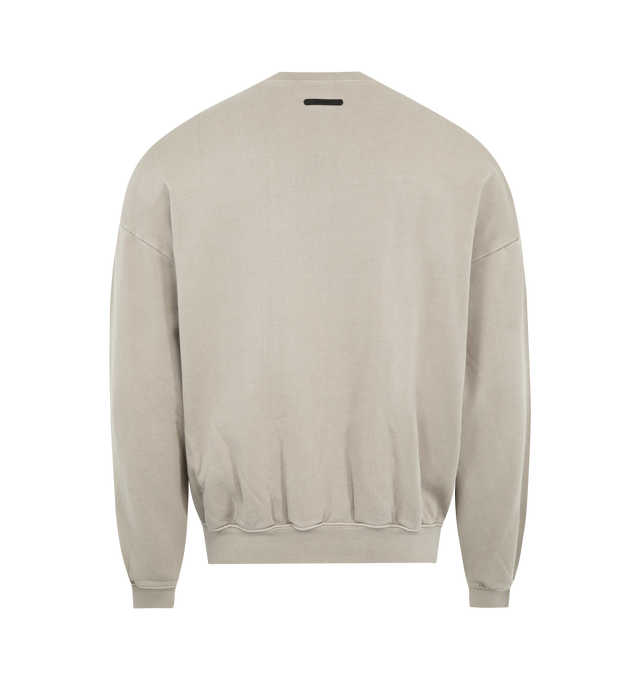Image 2 of 3 - BROWN - FEAR OF GOD ESSENTIALS Training 90s Crewneck Sweatshirt featuring cotton 390GSM fleece, pigment dyed, puff-printed Fear of God Essentials training logo is branded on the front, rib-knit collar, cuffs, waist-hem and Essentials signature label at the back collar. 100% cotton.