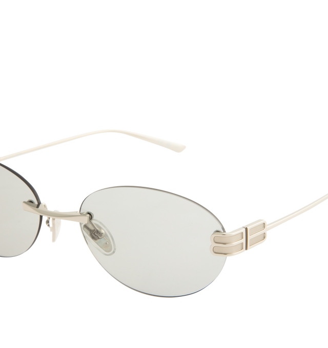 Image 3 of 3 - GREY - BALENCIAGA Gossip Oval AF Sunglasses featuring full metal temples and rimless frame, oval shape, adjusted fit, hidden hinges within the BB logo and adjustable nose pads with BB logo. 100% UVA/UVB protection. Made in Japan.