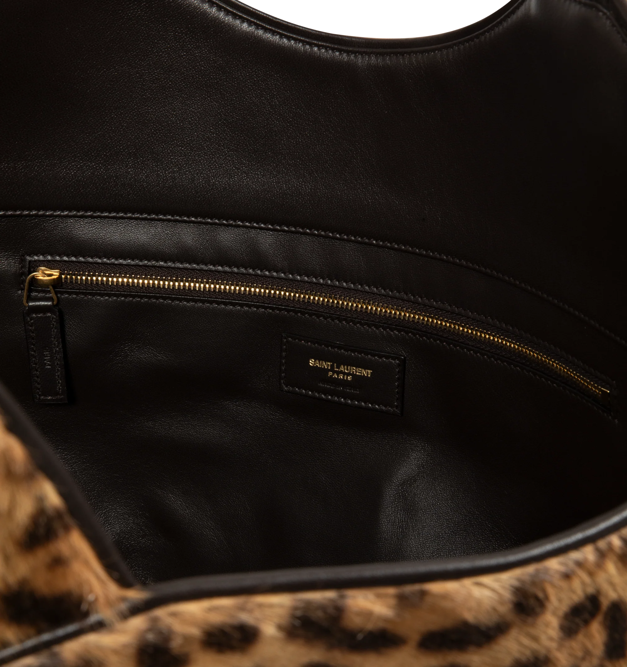 Image 3 of 3 - MULTI - Saint Laurent Icare Medium in Pony Hair Leather is crafted from leopard-print pony hair calfskin and features the houses iconic Icare silhouette in a versatile medium size. Designed for multiple carrying options, this spacious handbag is finished with leather lining and bronze-tone hardware. Fits a large phone, wallet, keys, and everyday essentials. Main Material: Calfskin. Hardware: Brass. Lining: Leather. Dimensions: 31-46 x 28 x 5-15 cm / 12.2-18.1 x 11 x 2-5.9 in. Handle Drop: 20
