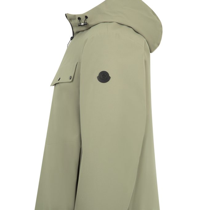 Image 3 of 3 - GREEN - MONCLER Escurays Hooded Short Down Jacket featuring 2L technical polyester, water-repellent main fabric, nylon lining, down-filled, adjustable hood, zipper closure, zipped pockets, adjustable hem and silicone logo patch. 100% polyester. Lining: 100% polyamide/nylon. Padding: 90% down, 10% feather. Made in Romania.