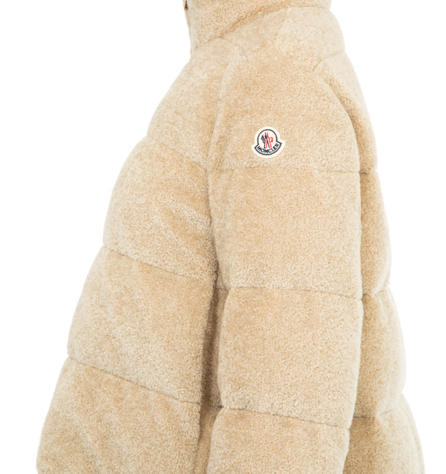 Image 3 of 3 - NEUTRAL - MONCLER Cedre Teddy Short Down Jacket featuring teddy fleece, longue saison lining, down-filled, stand collar, zipper closure, side pockets and longue saison hem with drawstring fastening. 60% acrylic, 40% cotton. Lining: 100% polyamide/nylon. Made in Romania. 