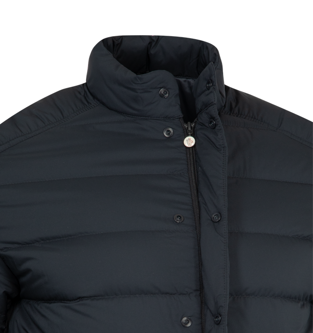Image 4 of 4 - NAVY - MONCLER Selves Short Down Jacket featuring water-repellent main fabric, longue saison lining, down-filled, zipper and snap button closure, zipped pockets, adjustable cuffs and hem with drawstring fastening. 100% polyamide/nylon. 90% down, 10% feather.  
