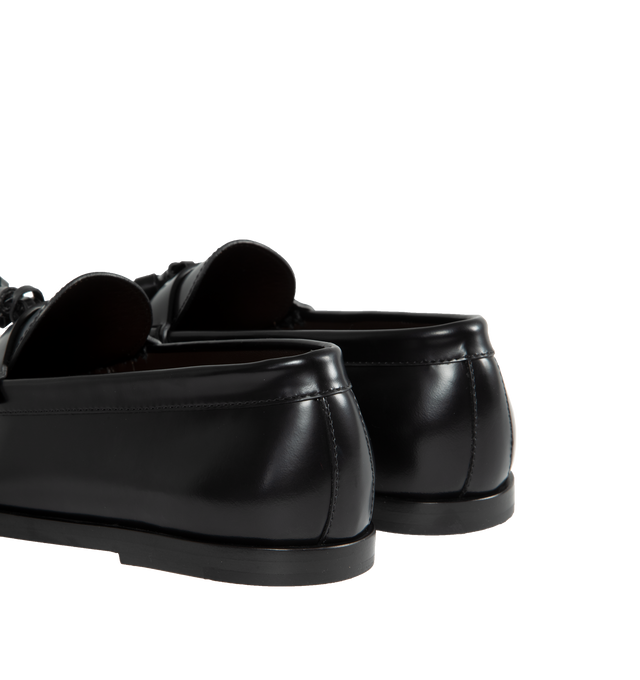 Image 3 of 4 - BLACK - THE ROW Loafer featuring sleek calfskin leather with natural pleating effect and tassel detailing. 100% leather. Made in Italy.
