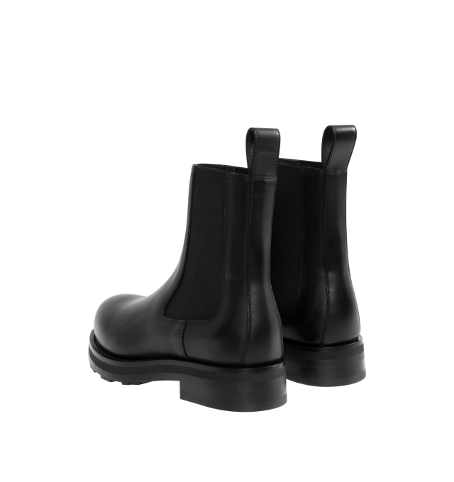 Image 3 of 4 - BLACK - THE ROW Chelsea Lug Sole Boots featuring round toe, pull-on style, branded leather insole, chunky rubber lug sole, ankle-length and elastic side panel. 100% calfskin leather. Sole: 100% rubber. Made in Italy.
