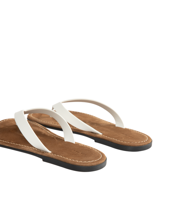 Image 3 of 4 - WHITE - THE ROW Beach Flip Flop featuring vegetable-tanned calfskin leather with seamless strap, padded goatskin insole and rubber sole. 100% calfskin leather. Synthetic sole. Made in Italy. 