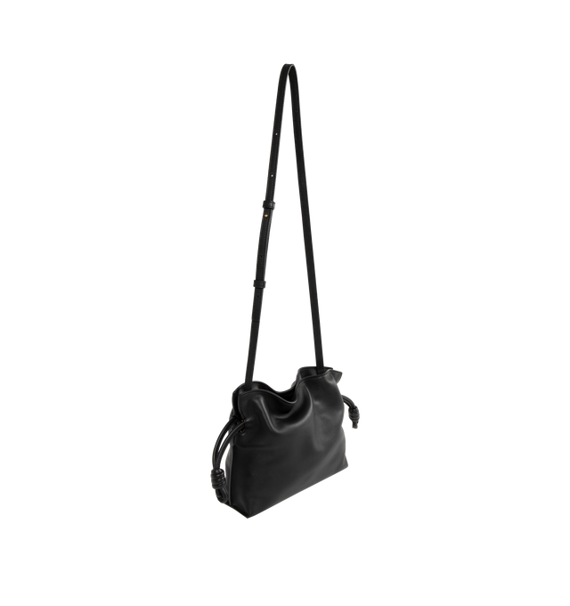 Image 2 of 3 - BLACK - LOEWE Mini Flamenco Clutch in nappa calfskin featuring a soft and slouchy bag with a cinched closure and historical knot drawstrings, shoulder, crossbody or hand carry, detachable and adjustable strap, discreet magnetic closure, suede lining and embossed Anagram. Nappa calf. 18 cm x 23.9 cm x 9 cm. Made in Spain.