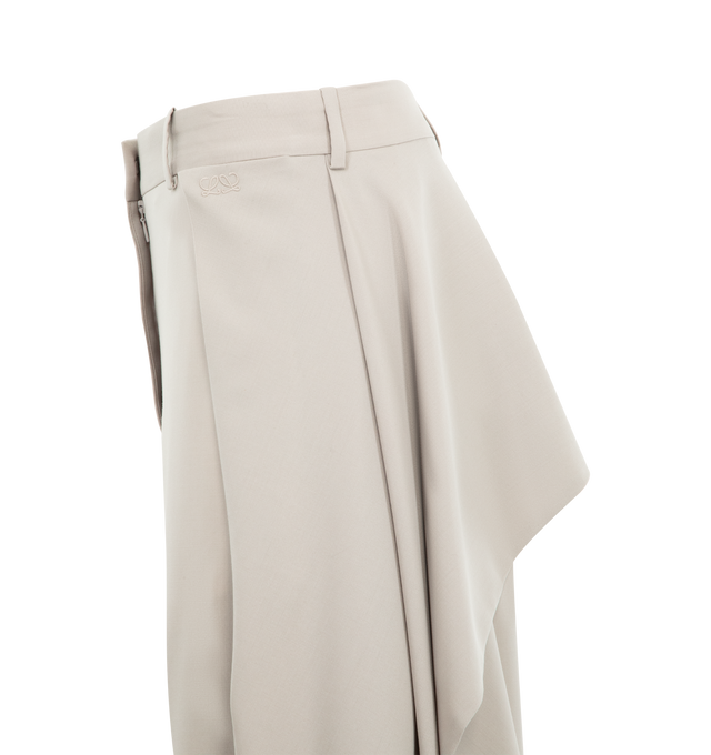 Image 3 of 3 - NEUTRAL - LOEWE Trousers in lightweight fluid wool tailoring featuring loose flaps at the sides and back that can be attached via a front button, regular fit, regular length, mid waist, wide leg, concealed zip fly, seam pockets and double L embroidery placed at the front. Wool. Made in Italy.