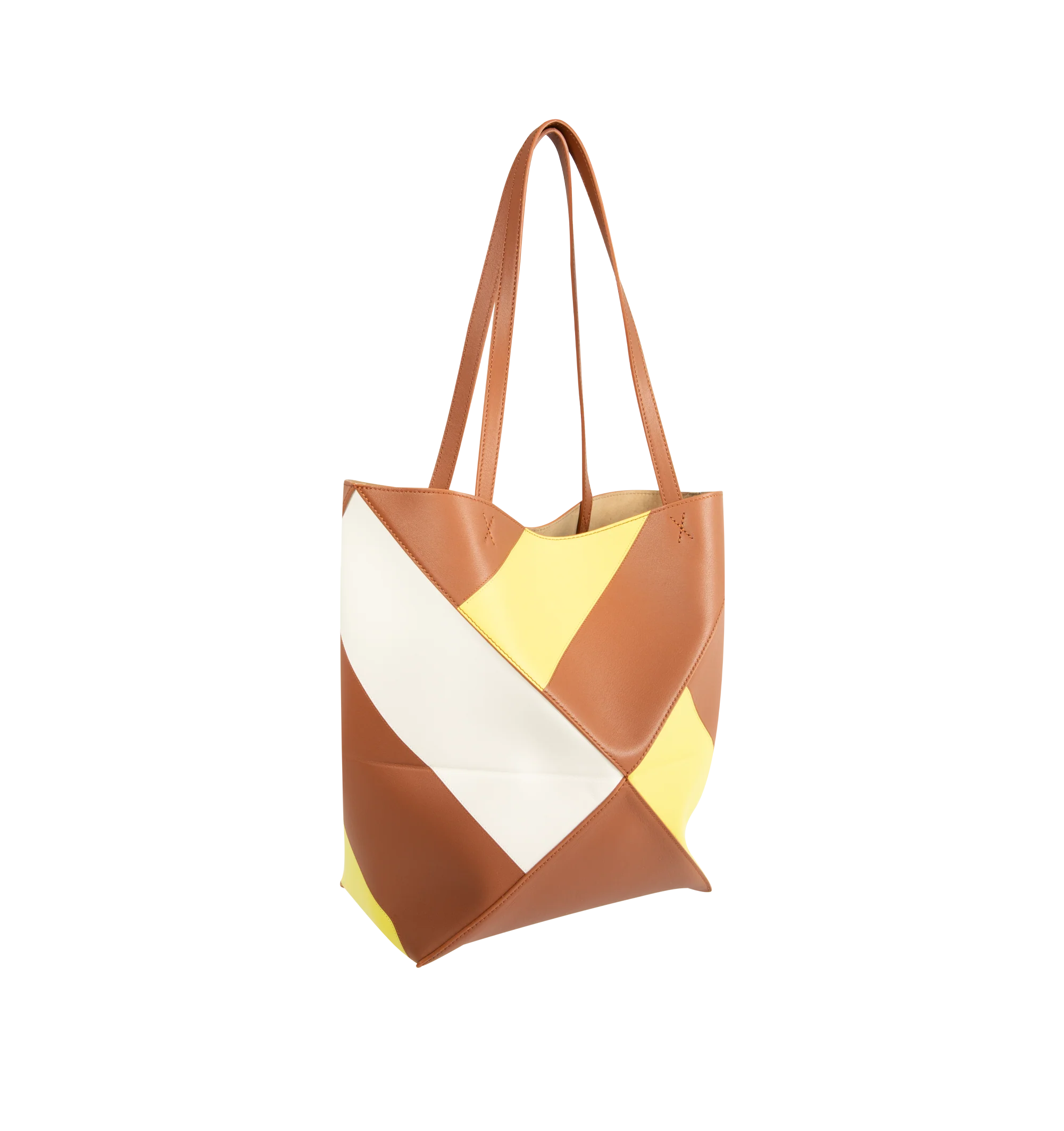 Image 2 of 3 - MULTI - Loewe Medium-Sized Puzzle Fold Graphic Tote Bag is crafted from calfskin leather and features the brand's signature geometric Puzzle Fold construction with a lightweight, foldable design. Designed with double top handles, a front logo detail, and multicolor graphic motifs created using Loewe's signature intarsia technique for a distinctive sculptural appearance. Main Material: Calfskin Leather. 