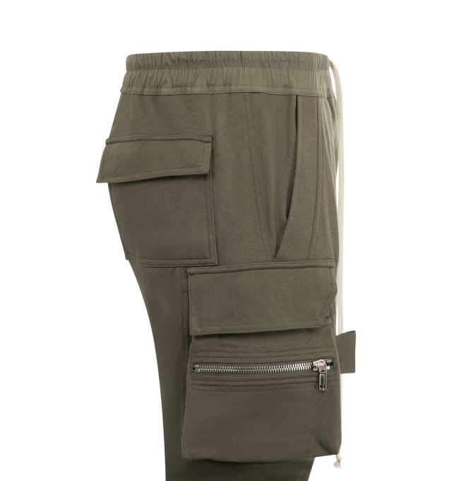 Image 3 of 3 - GREEN - RICK OWENS Mastadon Cargo Pants featuring slim-fit, stretch GOTS-certified organic cotton, drawstring at elasticized waistband, four-pocket styling, button fly, pen slots at front, elasticized cuffs and cargo and zip pocket at outseams. 97% cotton, 3% elastane. Made in Italy. 