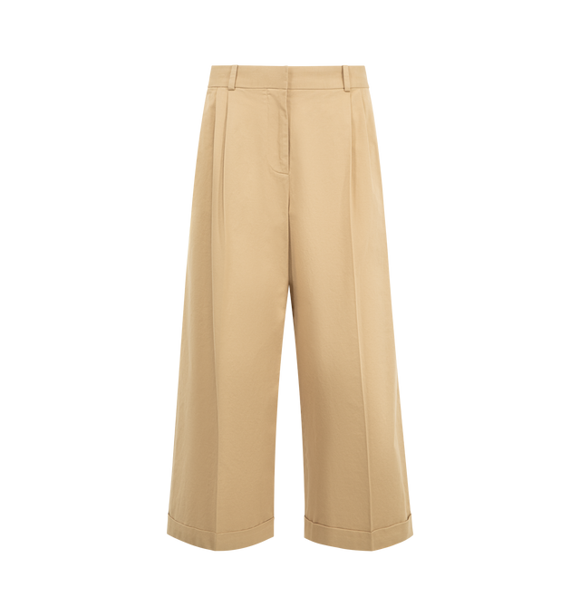 Image 1 of 3 - BROWN - THE ROW Lior Pant featuring tailored low-rise trouser in fluid Japanese wool gabardine with wide cuffed leg, front double pleats and side slash pockets. 100% wool. Made in Italy.