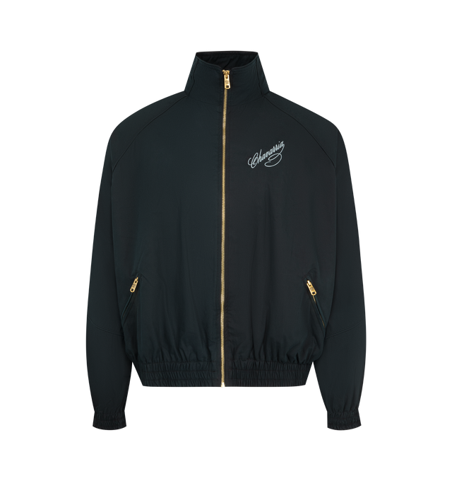Image 1 of 2 - BLACK - WILLY CHAVARRIA Ruff Rider Track Jacket featuring script logo on the front chest, stand collar, golden zip front, long dolman sleeves with elasticized cuffs, side zip pockets, elasticized hem and relaxed cut. Cotton. Made in USA.