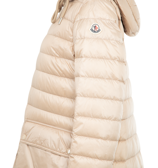 Image 3 of 3 - CHAMPAGNE - MONCLER Jasmin Hooded Short Down Parka featuring signature embroidered logo patch on the left sleeve, adjustable drawstring hood, long sleeves with elastic cuffs, flap pockets with snap closures, classic fit and two-way zip-front. Nylon/polyamide. Fill: Down/feather. Lining: Polyester. 
