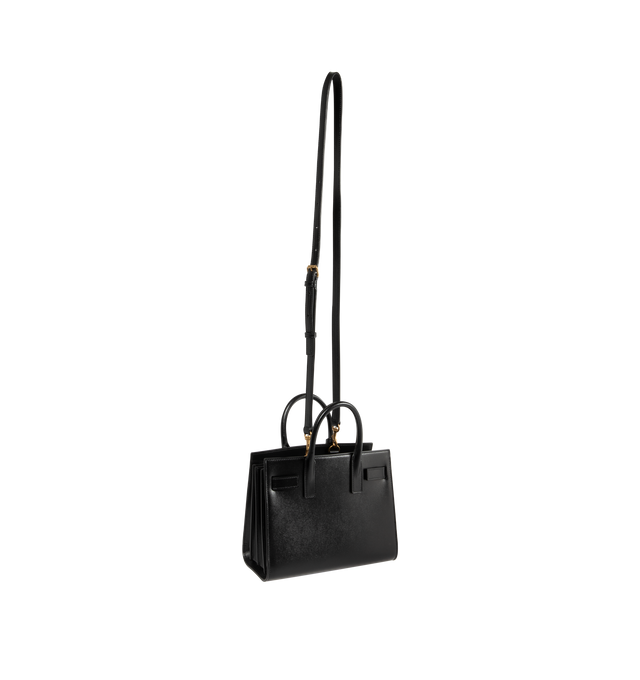 Image 2 of 3 - BLACK - SAINT LAURENT Sac De Jour Nano Bag featuring accordion sides, snap button closure, top handles, bronze-tone hardware, removable zipper compartment, and leather lining. 90% calfskin, 10% brass. Made in Italy.  