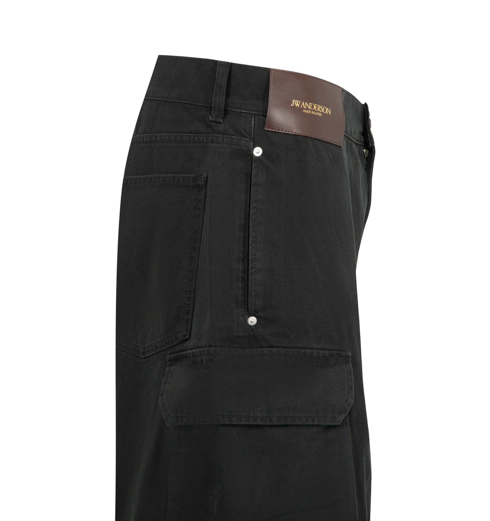 Image 3 of 3 - BLACK - JW Anderson Men's Twisted Patch Pocket Shorts featuring twisted patch pocket shorts, utilitarian detailing and logo embossed leather patch. 100% Cotton. Made in Japan.