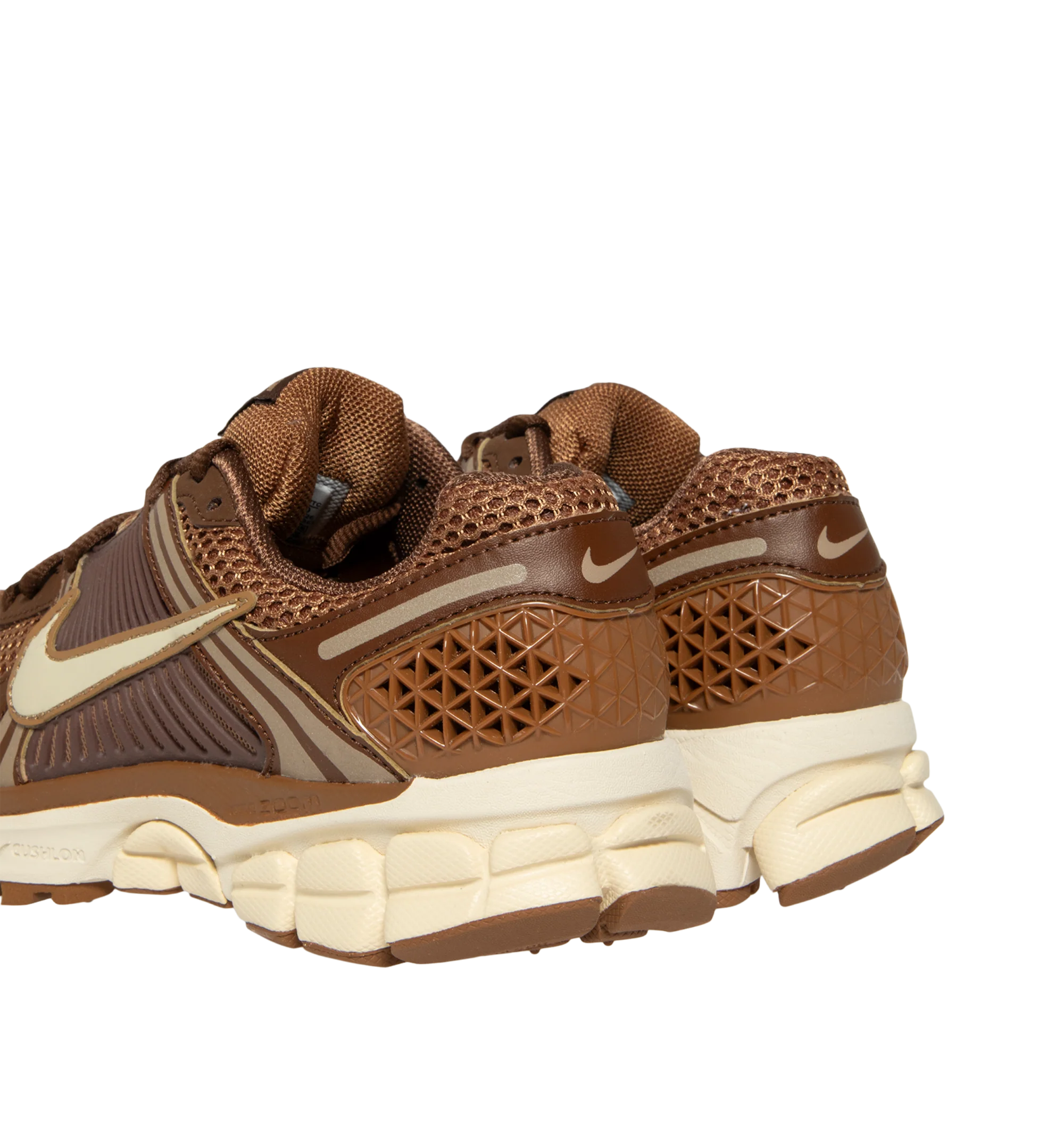 Image 3 of 5 - BROWN - Nike Womens Zoom Vomero 5 Sneakers feature a layered design with textile, synthetic leather, and plastic accents. Finished with Zoom Air cushioning, supportive side caging, reflective details, and a durable rubber outsole. Main Material: Textile, Synthetic Leather, Plastic; Outsole: Rubber. Imported
