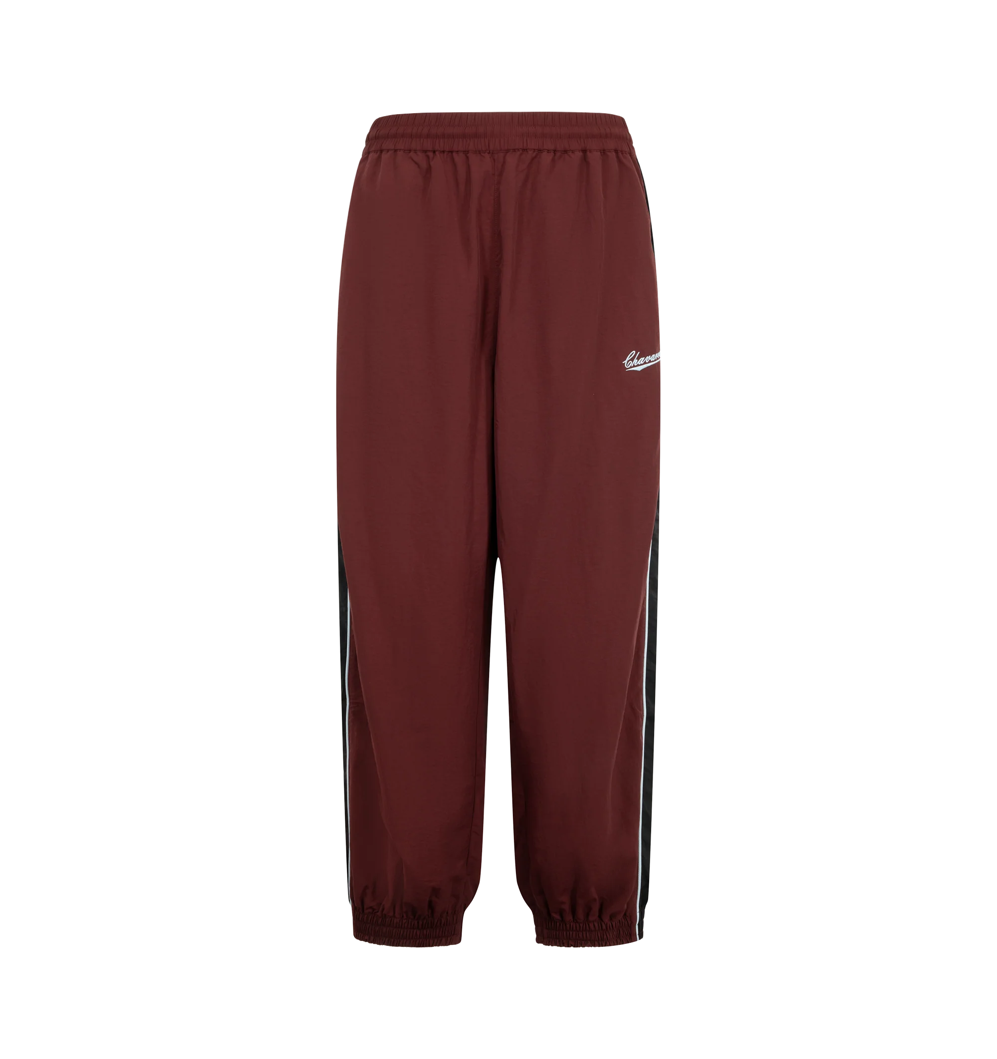 Image 1 of 3 - RED - Willy Chavarria Bad Boy Track Pant is crafted from lightweight nylon and features a relaxed athletic silhouette with an elasticated waistband and cuffs. Designed with a concealed drawstring waist, two seam pockets, embroidered logo detailing, and contrast piping along the outseams, the pant delivers the brand's bold sportswear-inspired aesthetic. Main Material: 100% Nylon.