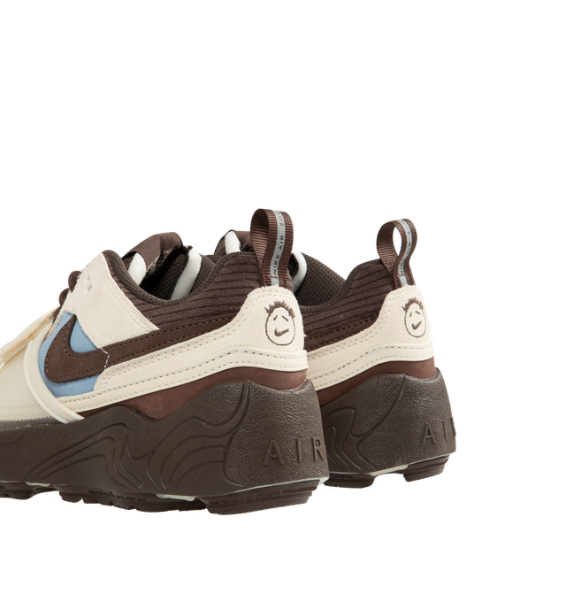 Image 3 of 5 - BROWN - NIKE Zoom Field Jaxx Sneaker featuring leather upper, suede mesh overlays, Nike patch on tongue, TPU eyelets, swoosh on lateral sides, Cactus branding on medial side, velcro closure on front, Cactus Jack smiley face logo on heel, heel pull, debossed A I R logo on rear, rope laces, wavy lines reminiscent on midsole and waffle rubber outsole.