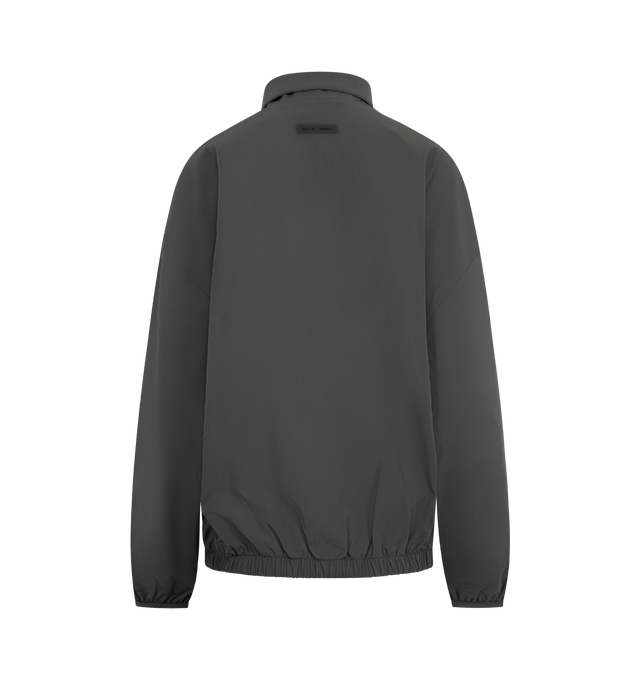 Image 2 of 3 - GREY - FEAR OF GOD ESSENTIALS Nylon Half Zip Track Jacket featuring nylon-spandex, detailed with an metallic 3M-printed Essentials graphic on the sleeves, relaxed, rounded silhouette, high neck, half-zip front, elasticized cuffs and waist hem and a Fear of God Essentials rubberized label stitched at the back. 84% nylon, 16% spandex.
