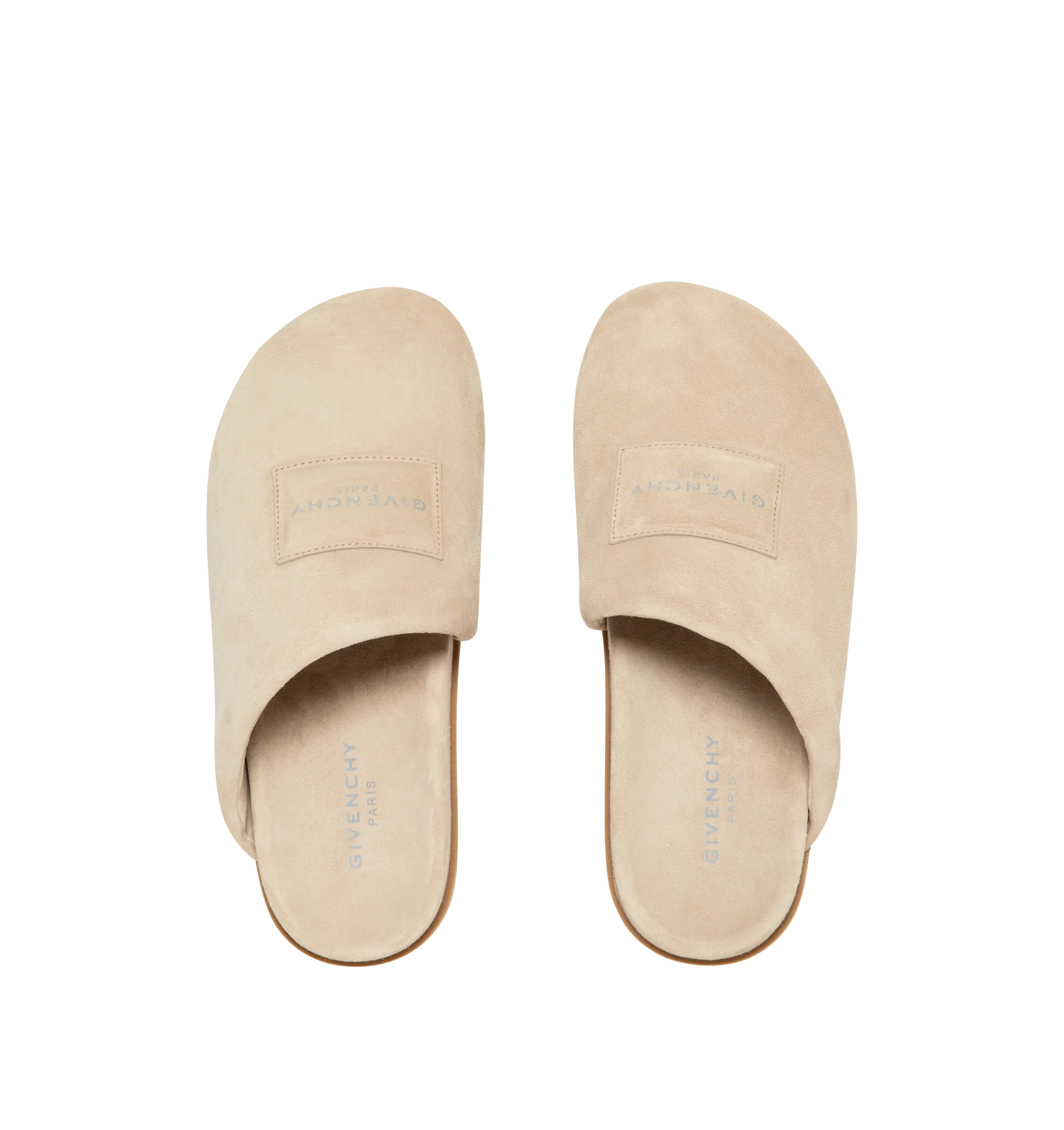 Image 5 of 5 - NEUTRAL - Givenchy Puffy Mules in Suede are crafted from supple calfskin suede and feature the house's signature Puffy silhouette with an asymmetric, slip-on design. Designed with a tonal padded label accented by a silvery Givenchy Paris logo, a branded leather insole, and a raised Givenchy signature beneath the sole, the mules combine comfort with a refined contemporary aesthetic. Main Material: 100% Calfskin Leather. Lining: 100% Calfskin Leather. Made in Italy.