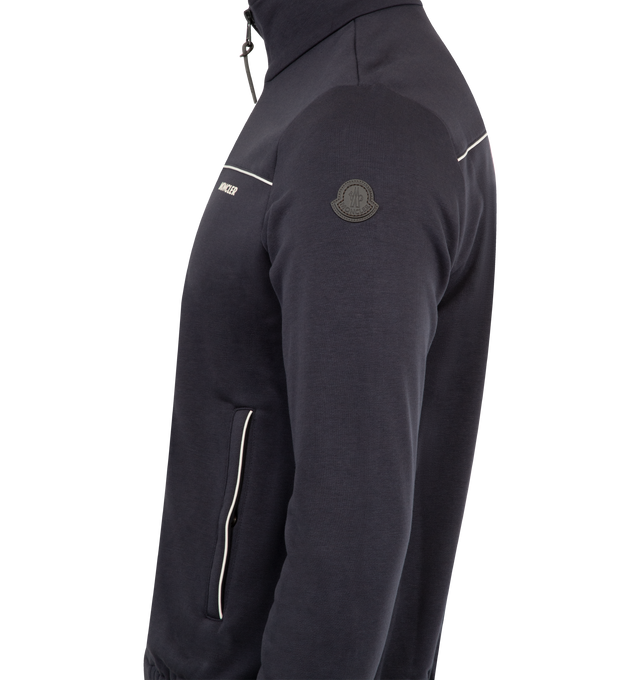 Image 3 of 3 - NAVY - MONCLER Fleece Zip Jacket featuring contrast piping, comfortable fleece, stand collar, two-way zipper, logo text front, welt pockets and banded cuffs and hem. 44% cotton, 44% modal, 12% polyester. 